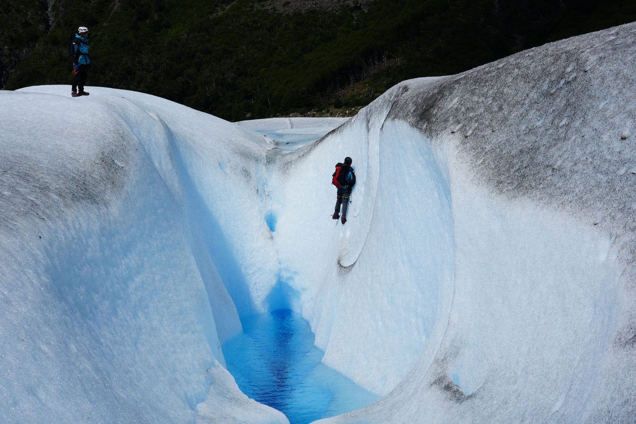 A Person by the Glacier Wall