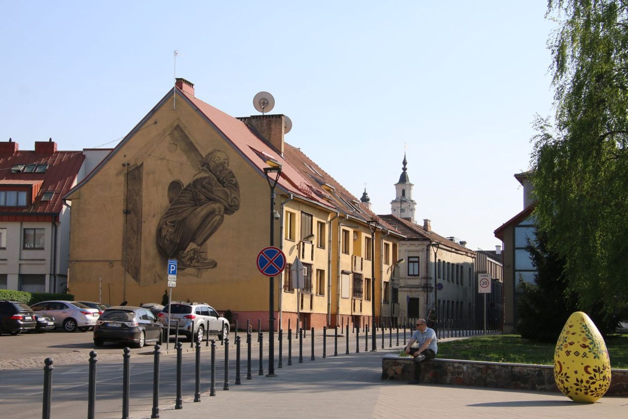 The "I've Returned Home" mural and a decorated easter egg sculpture
