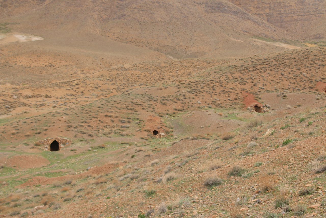 Traditional livestock shelters dug into the hillside