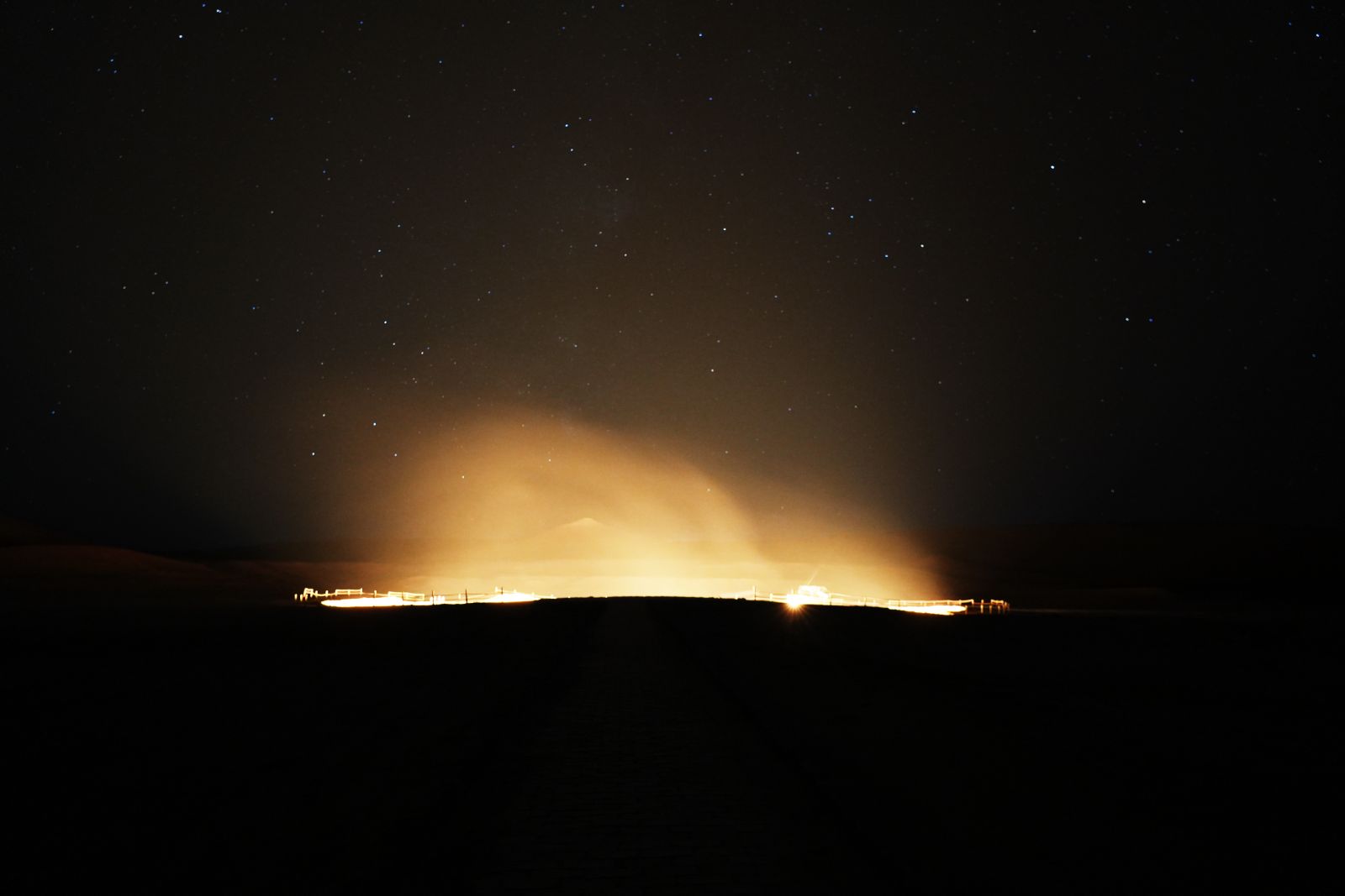 Glow from Darvaza Gas Crater and Starry Sky