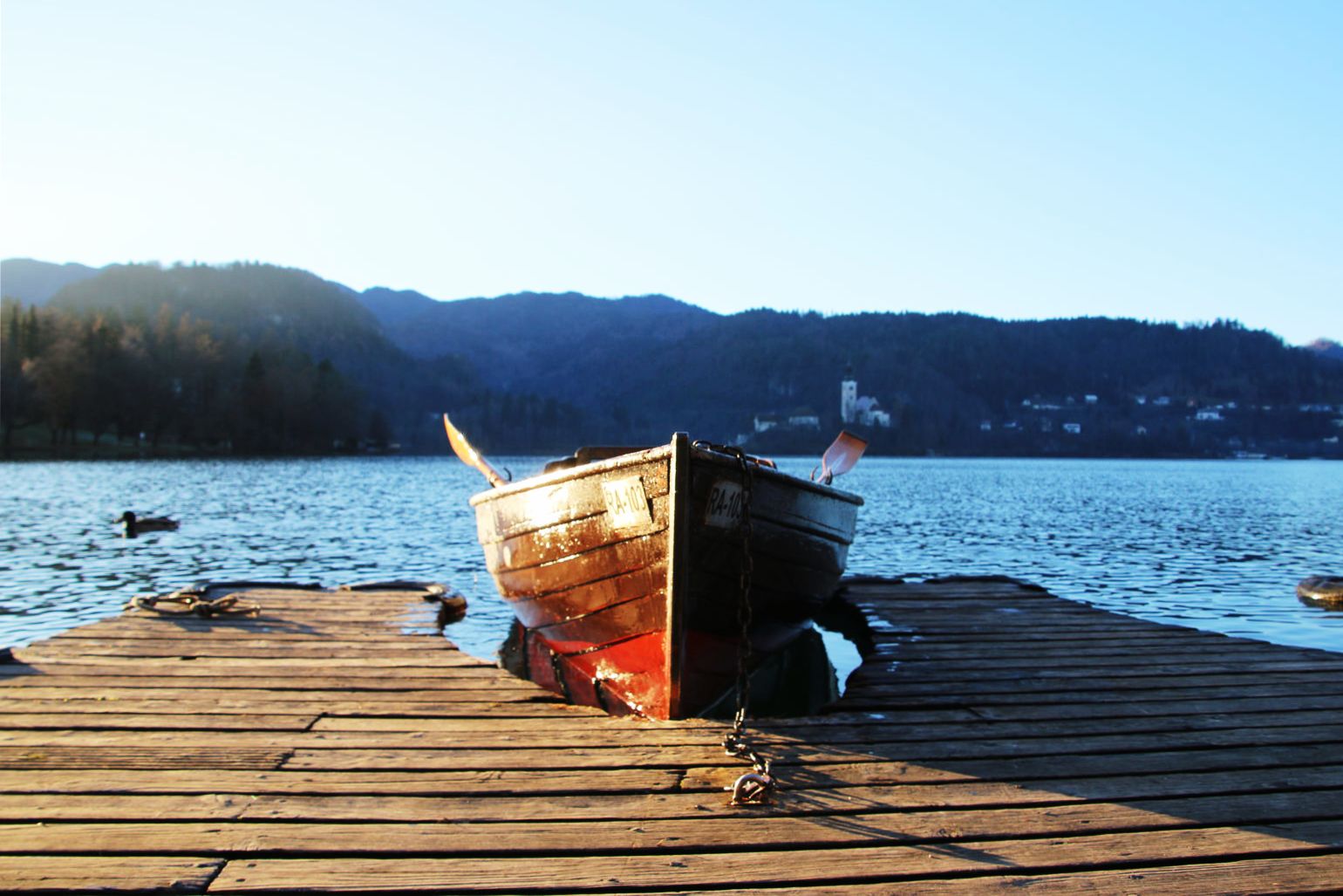 Wooden boat tied to the pier