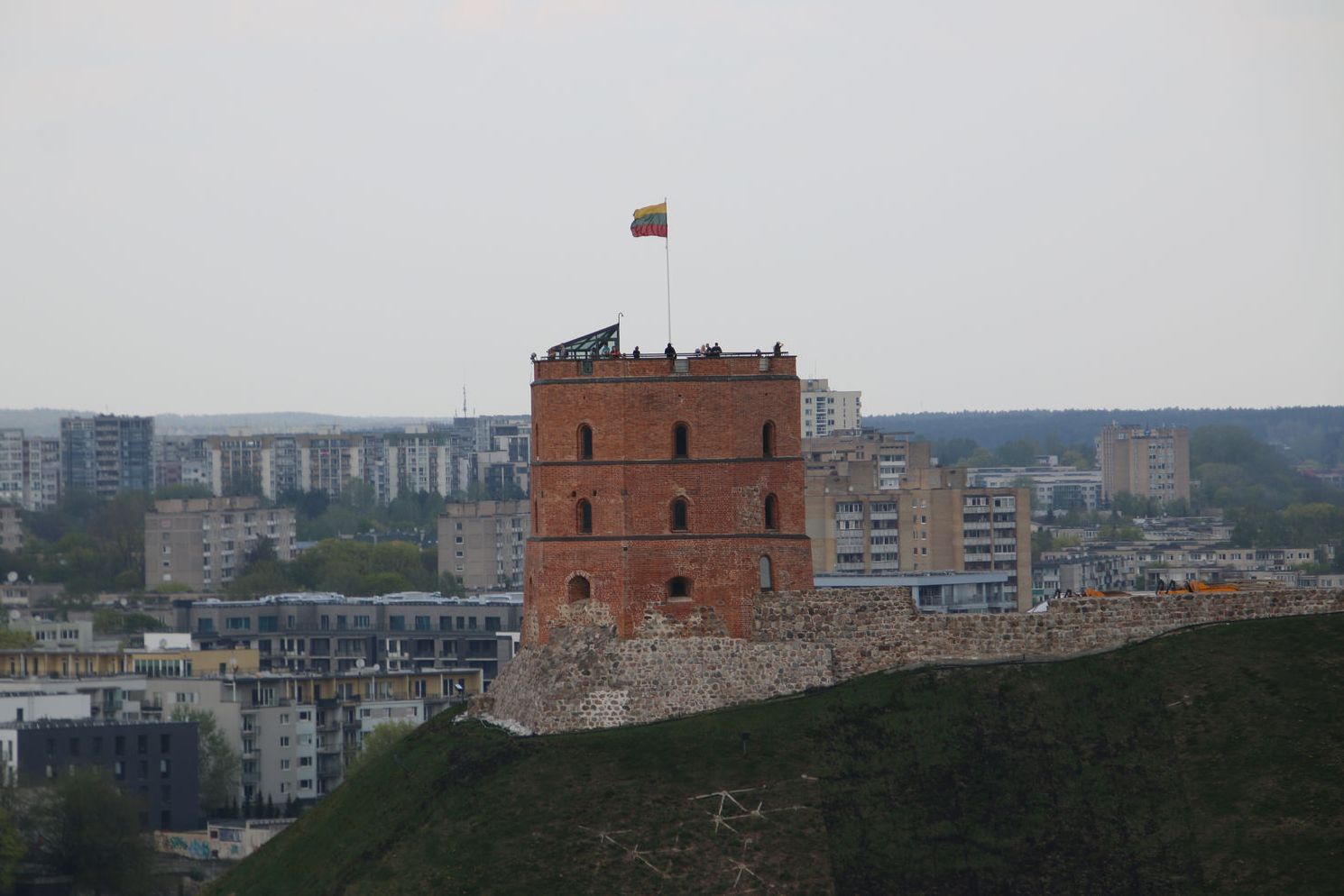 Gediminas' Tower flying a national flag on top of the hill