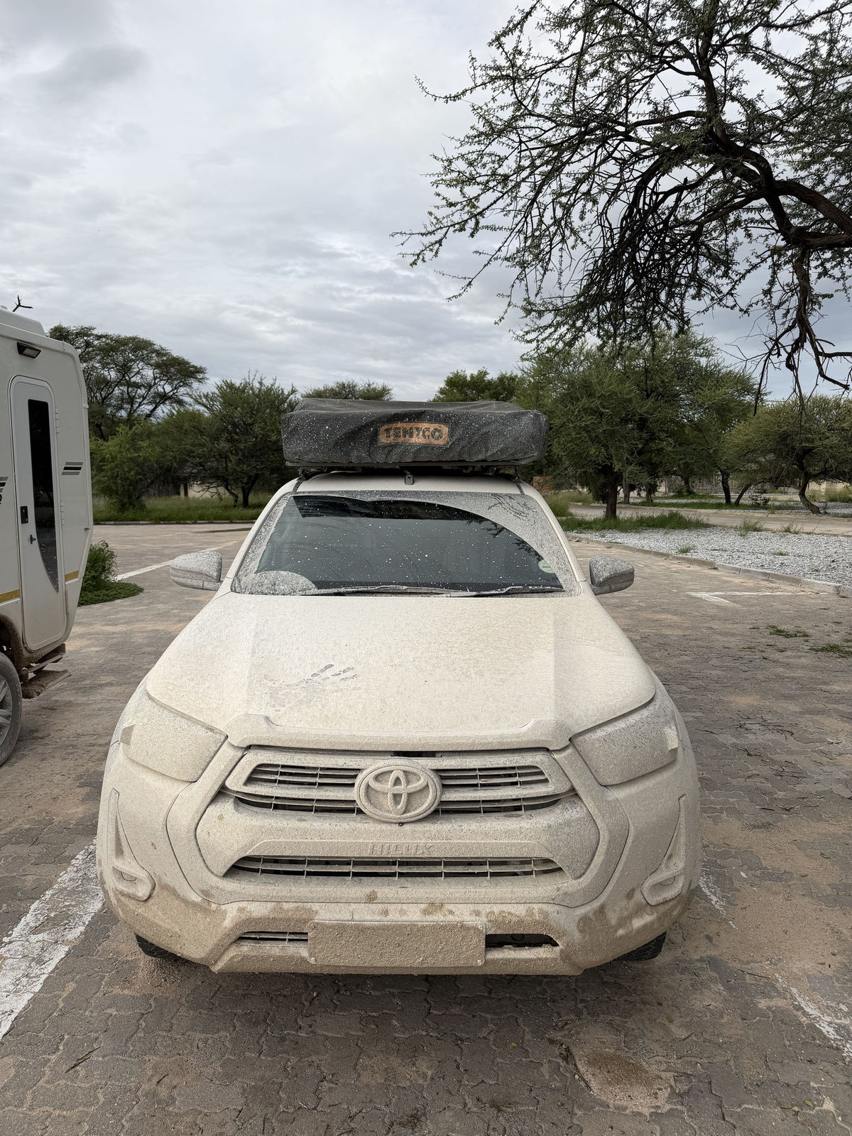 A mud-splattered 4x4 after a long drive